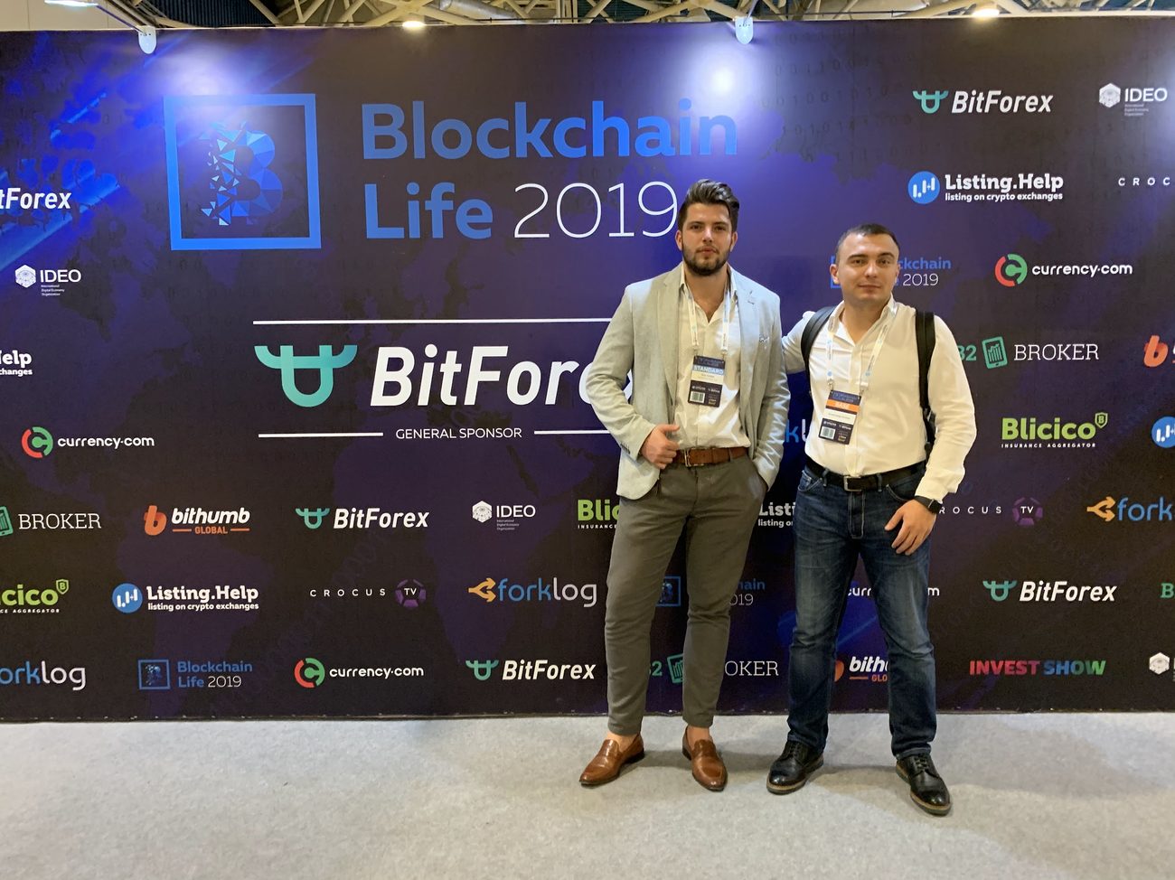 Igor Haleta at Blockchain Life 2019 with the BitForex general sponsor backdrop