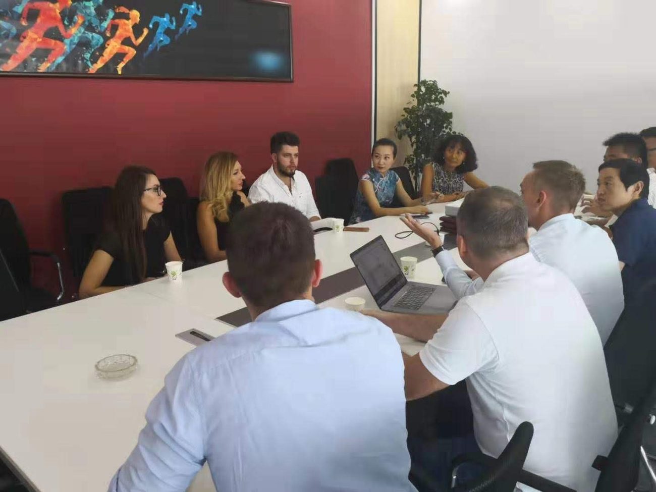 Igor Haleta in a boardroom meeting on a crypto investment roadshow in China